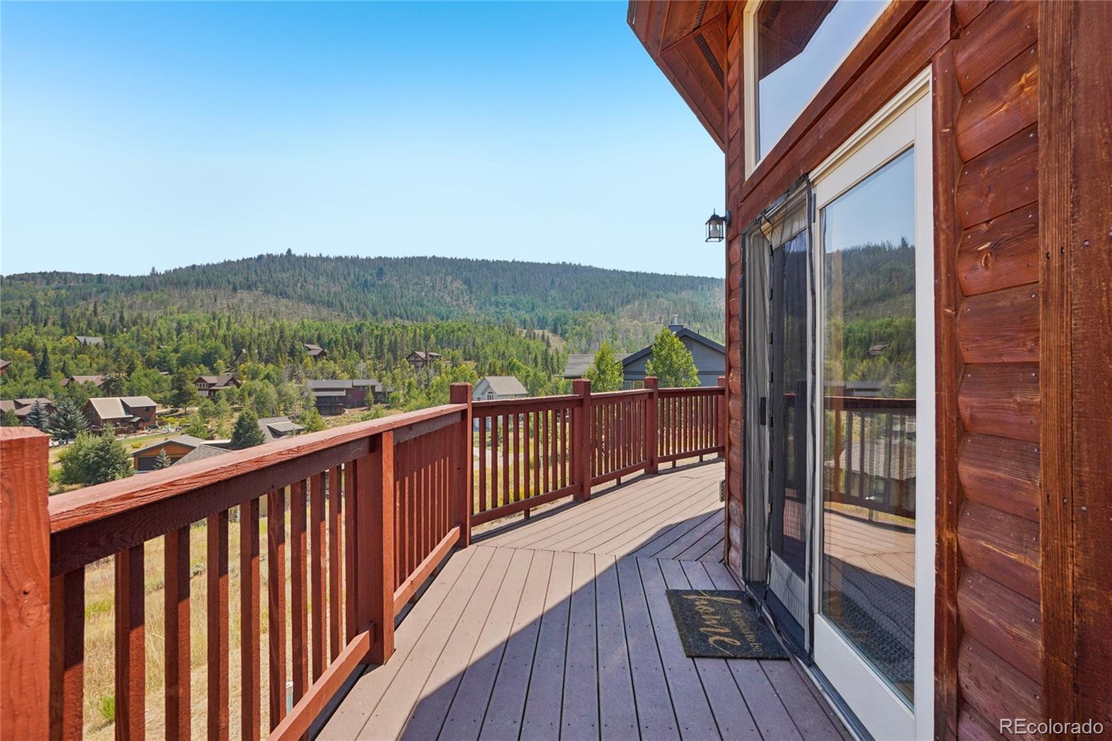 108 Hummingbird Way Granby, CO 80446 - Photo 36 of 46 a view of a balcony with wooden floor and fence