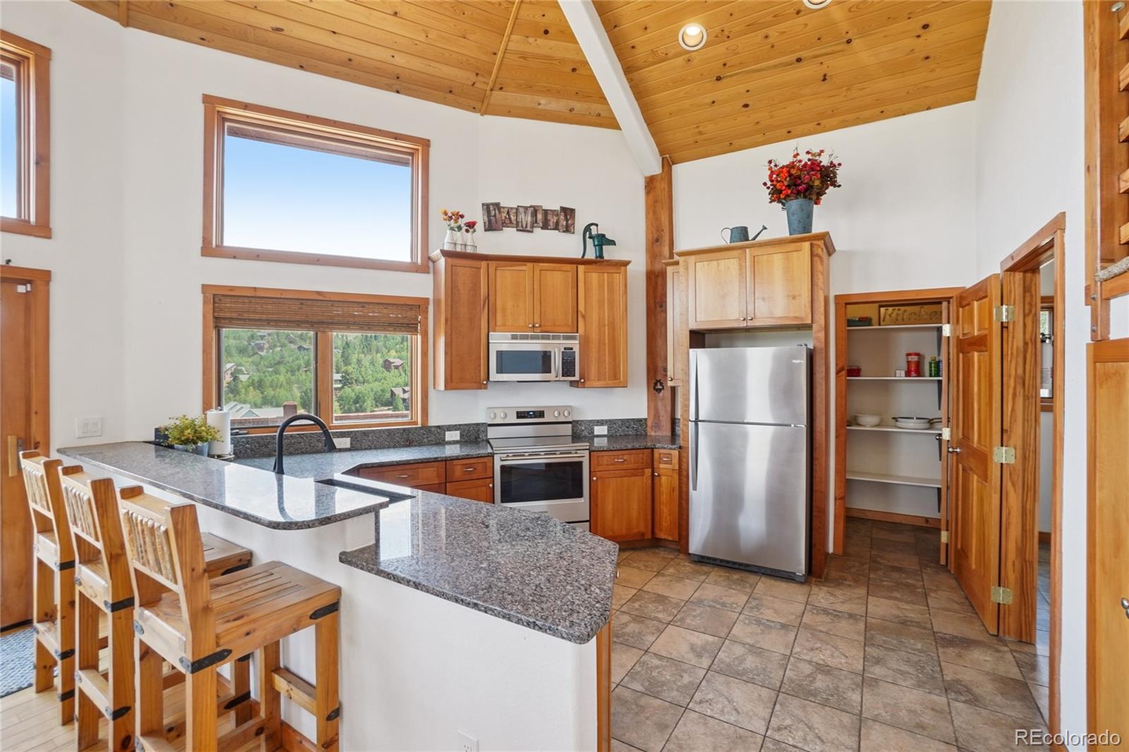 108 Hummingbird Way Granby, CO 80446 - Photo 8 of 46 a kitchen with refrigerator and cabinets