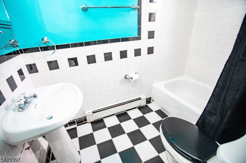 1130 Valley Road, Unit 2B Wayne, NJ 07470 - Photo 22 of 47 a bathroom with a sink toilet and shower