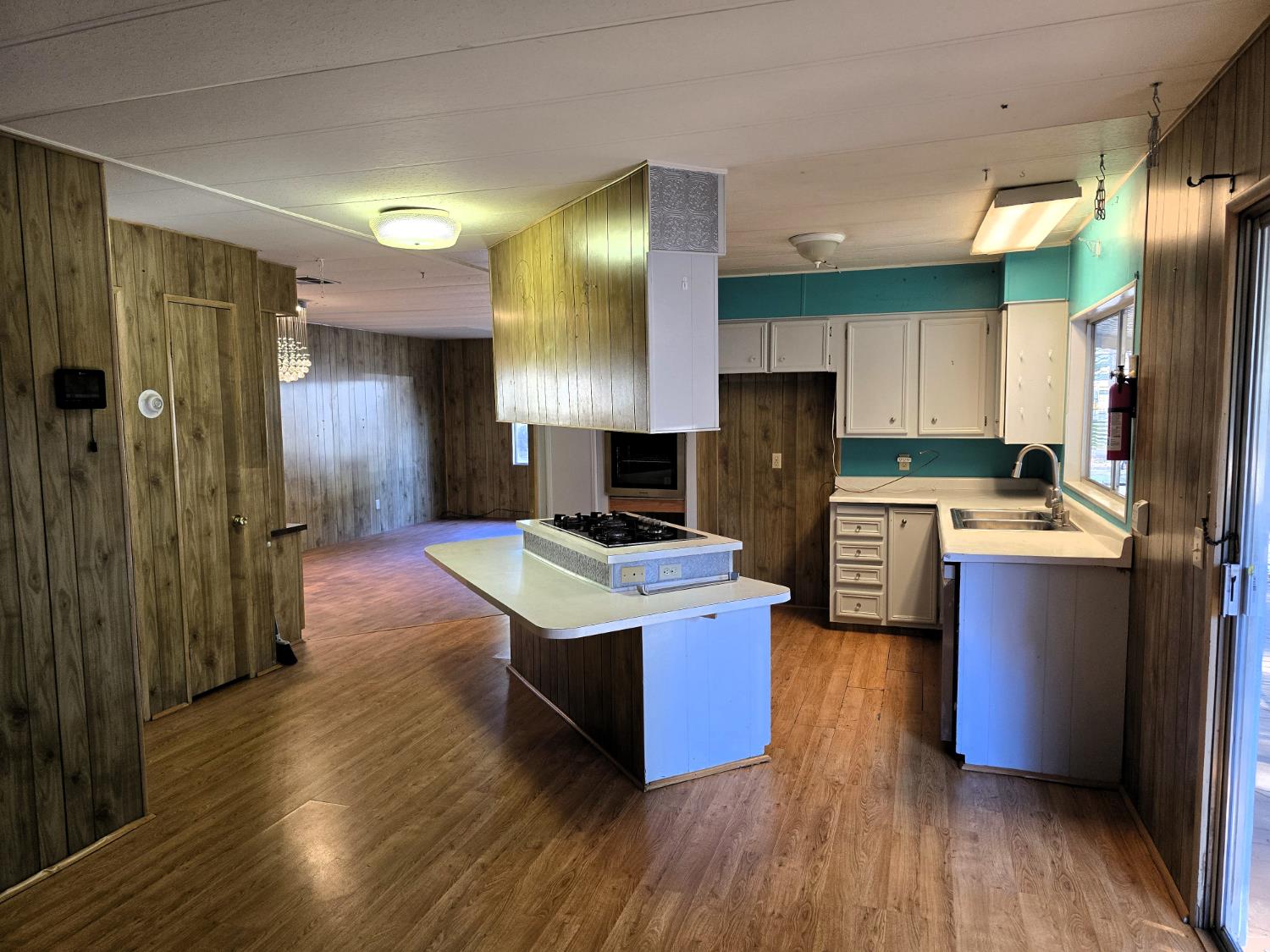 30 Candy Lane Grass Valley, CA 95945 - Photo 12 of 48 a large kitchen with stainless steel appliances kitchen island granite countertop a refrigerator a stove a sink and a wooden cabinets