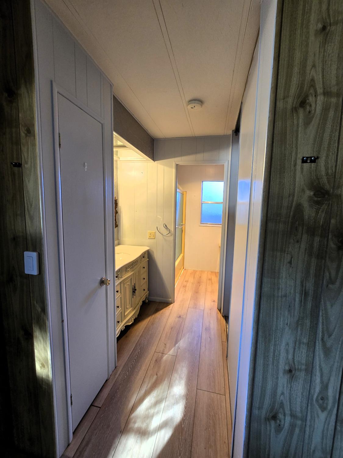 30 Candy Lane Grass Valley, CA 95945 - Photo 23 of 48 a view of hallway with window and wooden floor
