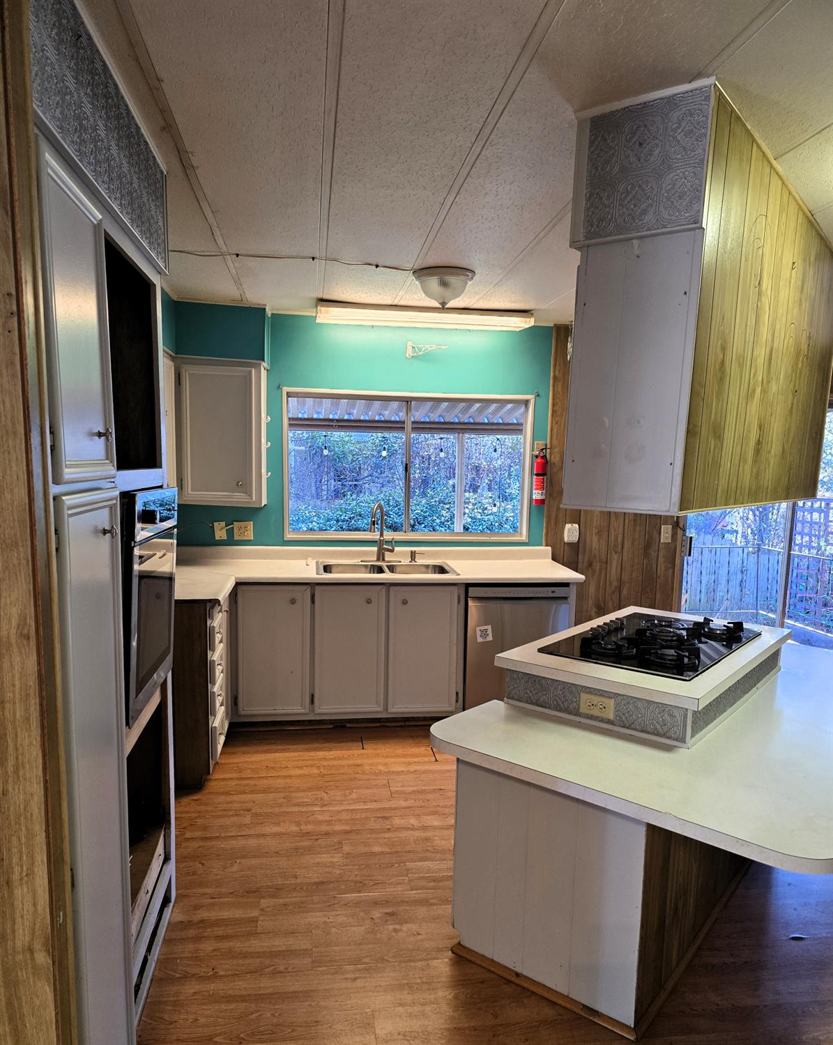 30 Candy Lane Grass Valley, CA 95945 - Photo 8 of 48 a kitchen with stainless steel appliances a stove a sink and a refrigerator
