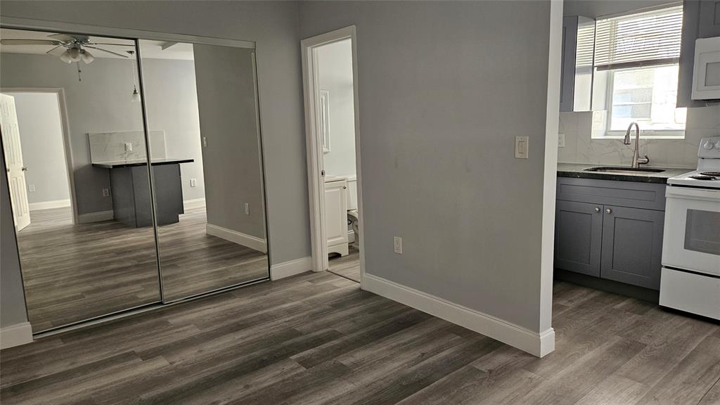 1142 Southwest 4th Street, Unit 3 Miami, FL 33130 - Photo 13 of 17 a view of a kitchen from the hallway