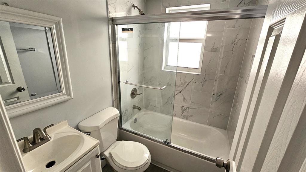 1142 Southwest 4th Street, Unit 3 Miami, FL 33130 - Photo 6 of 17 a bathroom with a sink toilet a mirror and shower