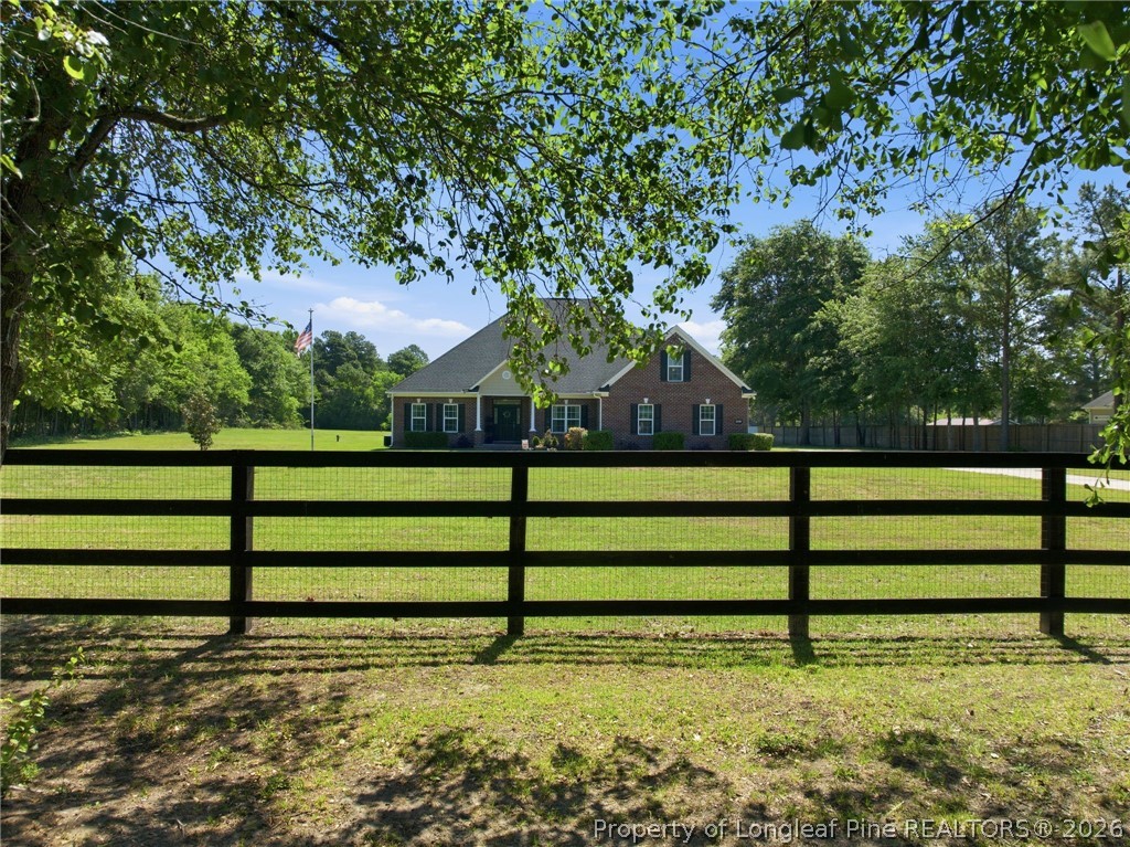 2589 June Johnson Road Raeford, NC 28376 - Photo 44 of 49 a view of backyard with wooden fence