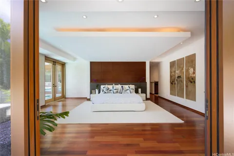 a large white bed in a white room