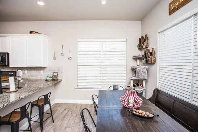 a bedroom with furniture and a window