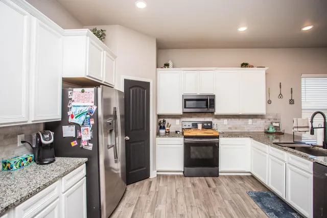 a bedroom with furniture and a window