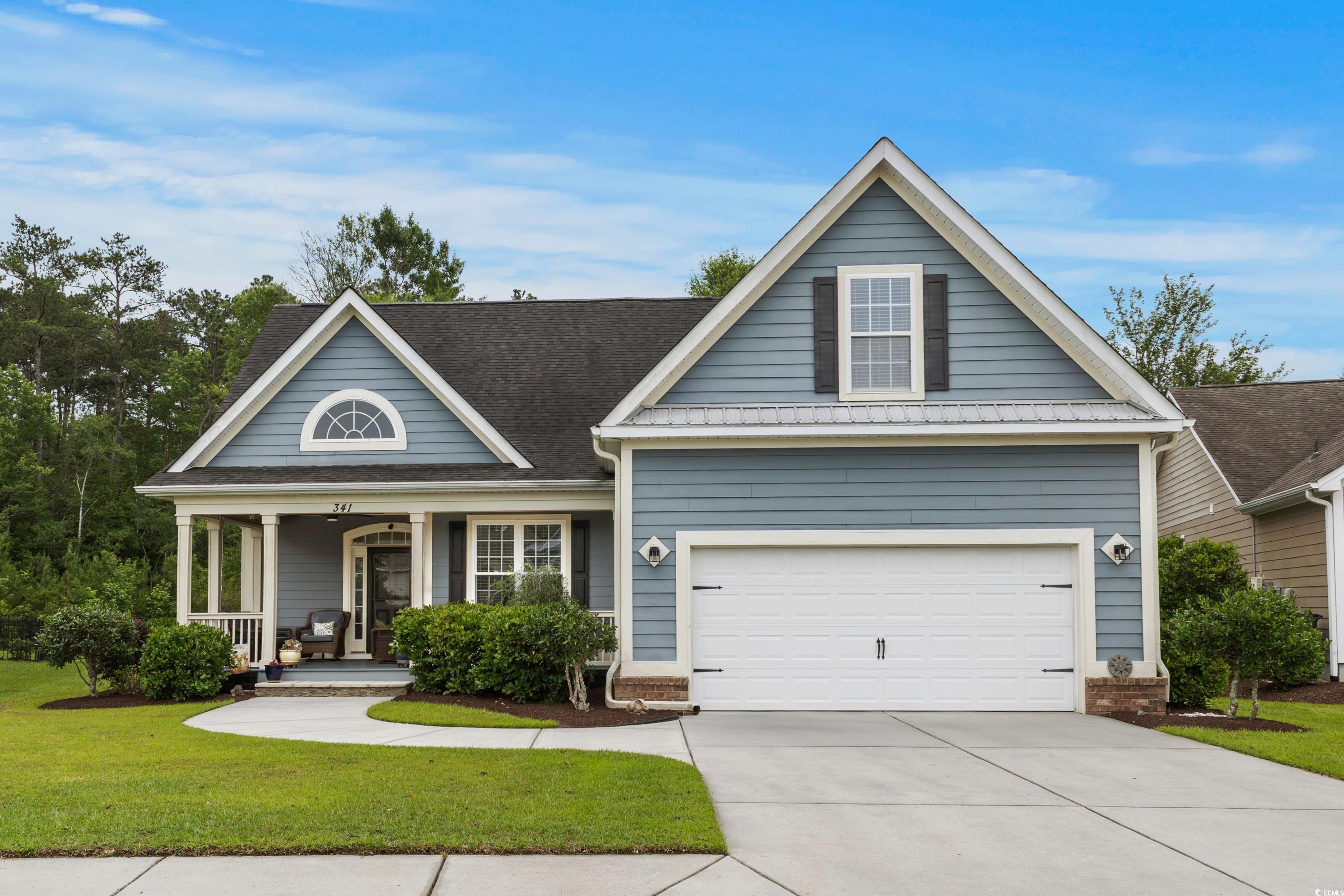 341 Bahama Drive Murrells Inlet, SC 29576 - Photo 1 of 40 View of front of home featuring a front lawn, driveway, and a porch