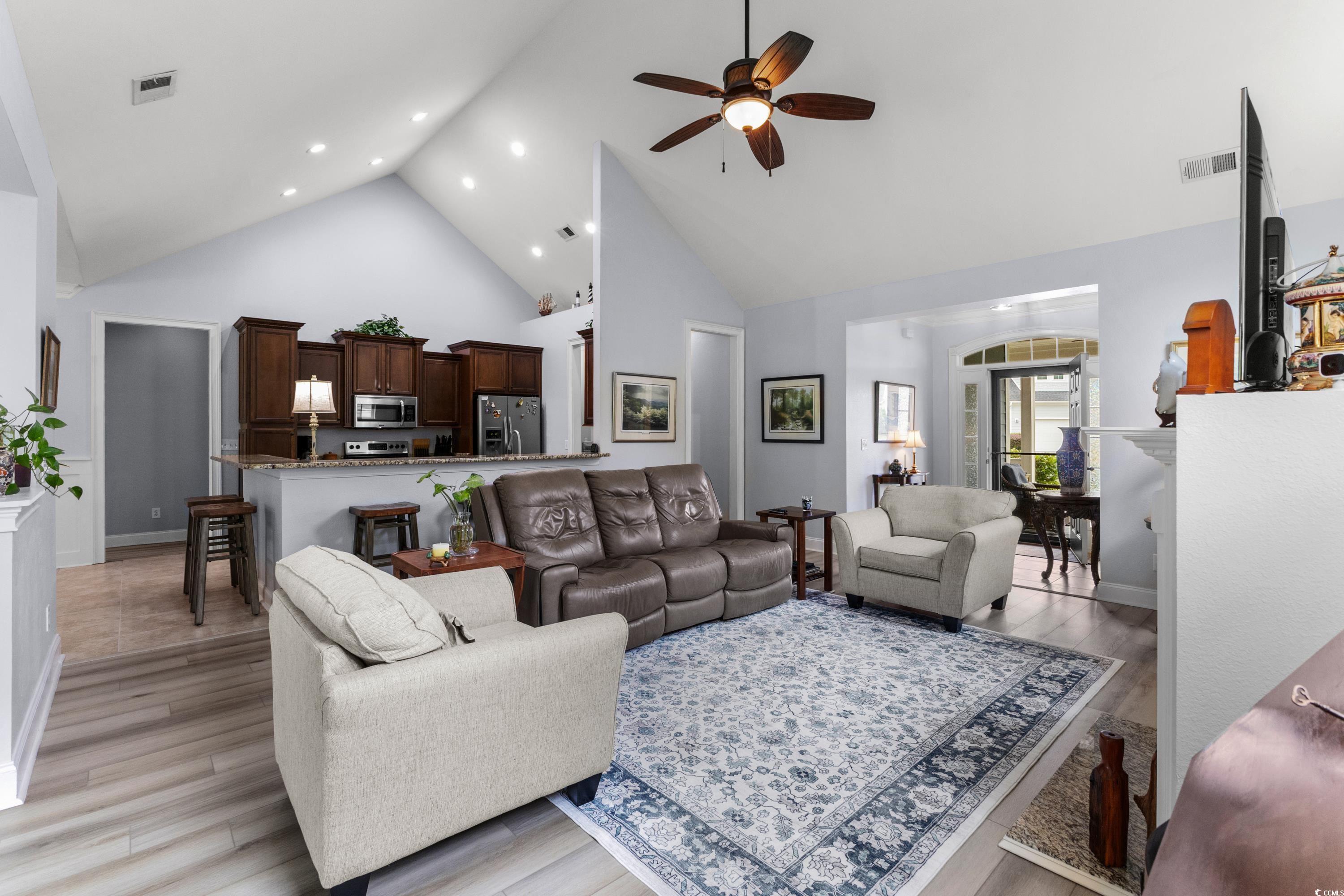 341 Bahama Drive Murrells Inlet, SC 29576 - Photo 8 of 40 Living area featuring high vaulted ceiling, a ceiling fan, light wood-type flooring, recessed lighting, and baseboards