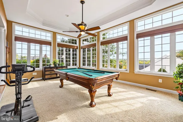a kitchen with stainless steel appliances granite countertop a sink and wooden cabinets
