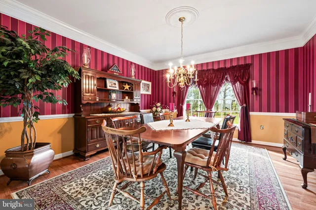 a kitchen with stainless steel appliances granite countertop a refrigerator a stove and a sink