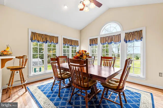 a view of a hallway and a livingroom with furniture