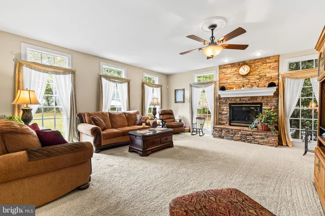 a spacious bathroom with a granite countertop sink mirror and shower