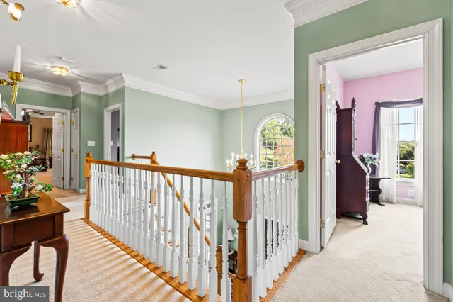 a living room with furniture and a lamp