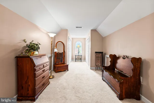 a en suite bathroom with a double vanity sink a mirror and a shower
