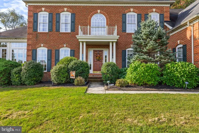 a view of a livingroom with furniture and a potted plant