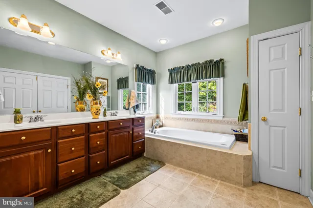 a bathroom with a toilet sink and shower curtain