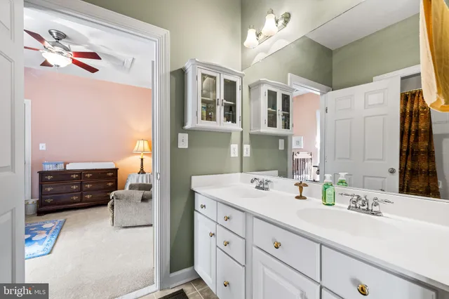 a dining area with furniture and a kitchen view