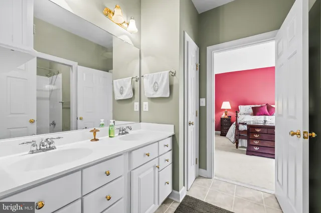 a kitchen with stainless steel appliances granite countertop a refrigerator stove and sink