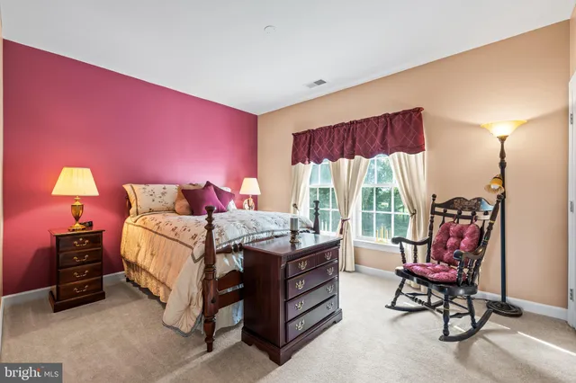a kitchen with stainless steel appliances a refrigerator and a stove top oven