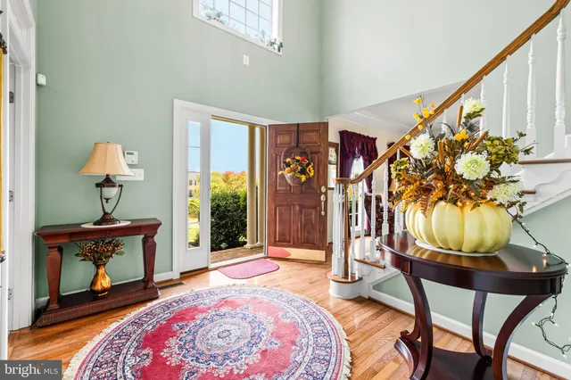 a view of entryway dining room and hall with wooden floor