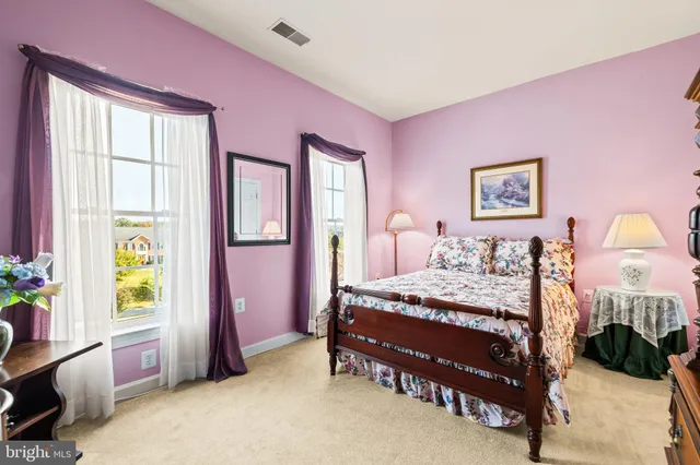 a white toilet sitting next to a shower