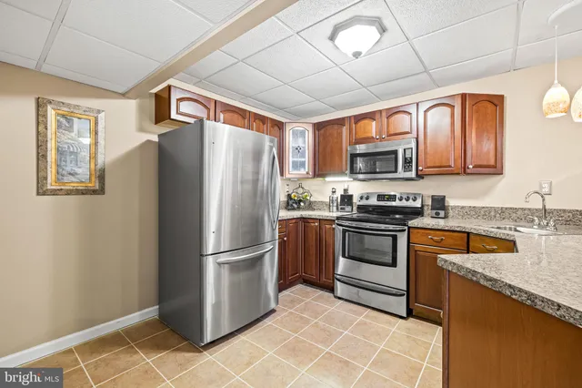 a view of a swimming pool with lawn chairs and a big yard