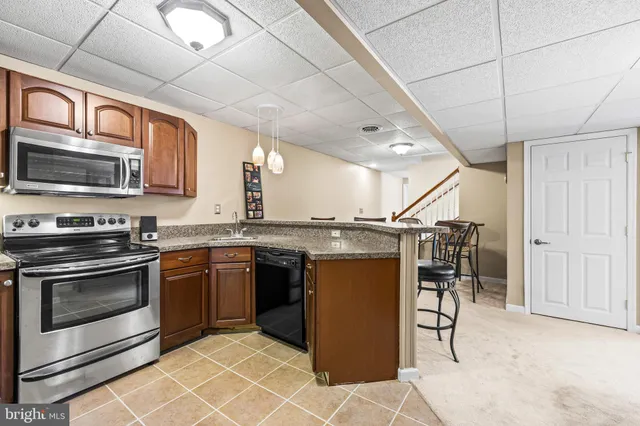 a front view of house with outdoor seating