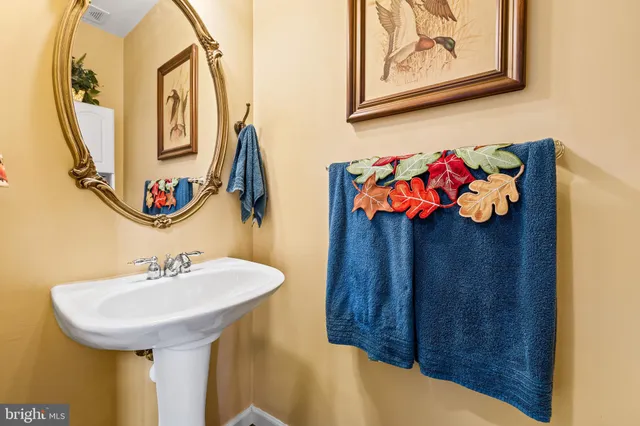 a living room with furniture a rug and a large window