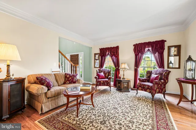 a room with pool table and windows