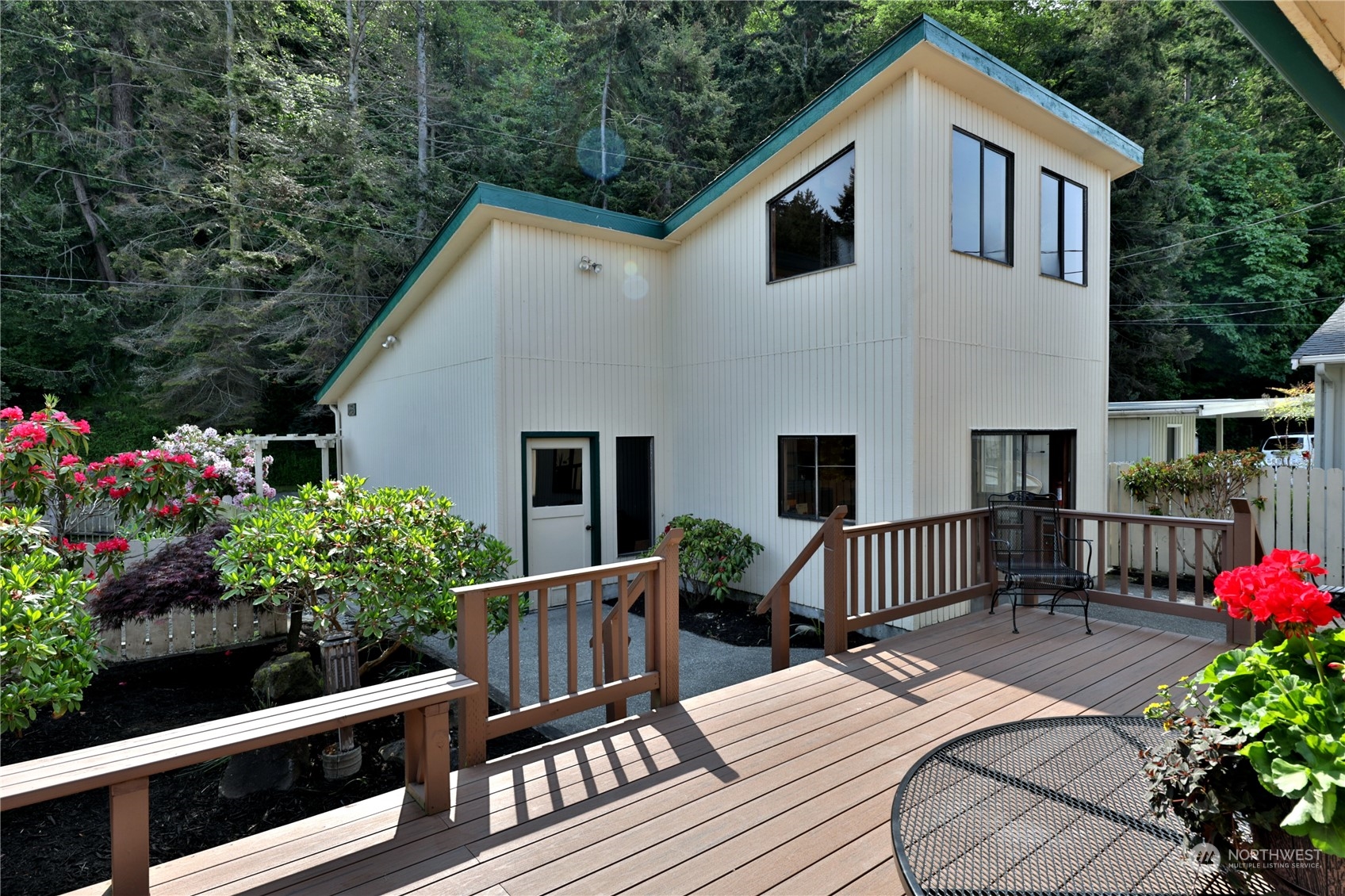 6288 Barr Beach Road Freeland, WA 98249 - Photo 13 of 40 a view of a house with wooden fence
