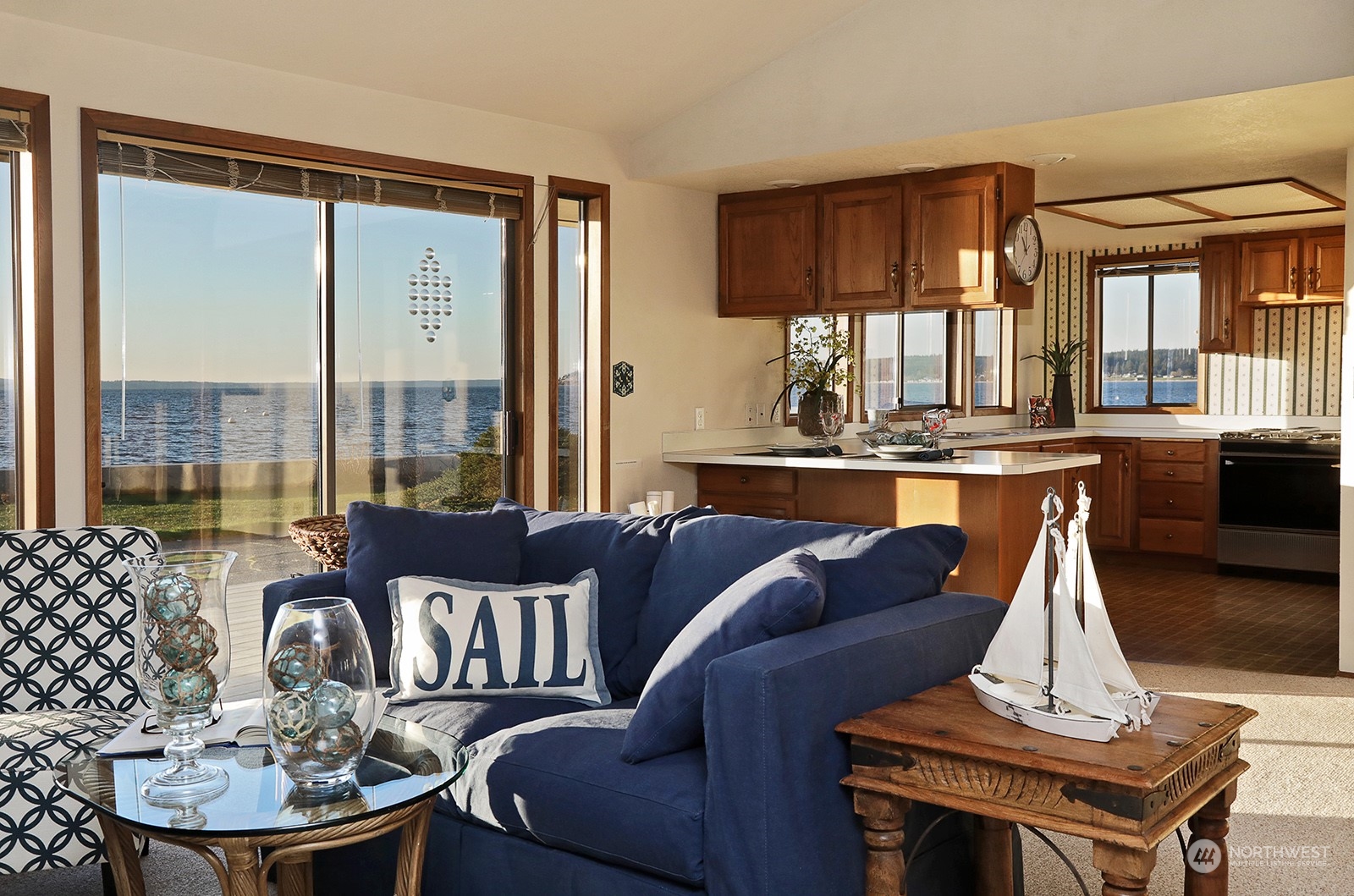 6288 Barr Beach Road Freeland, WA 98249 - Photo 17 of 40 a living room with furniture and a large window