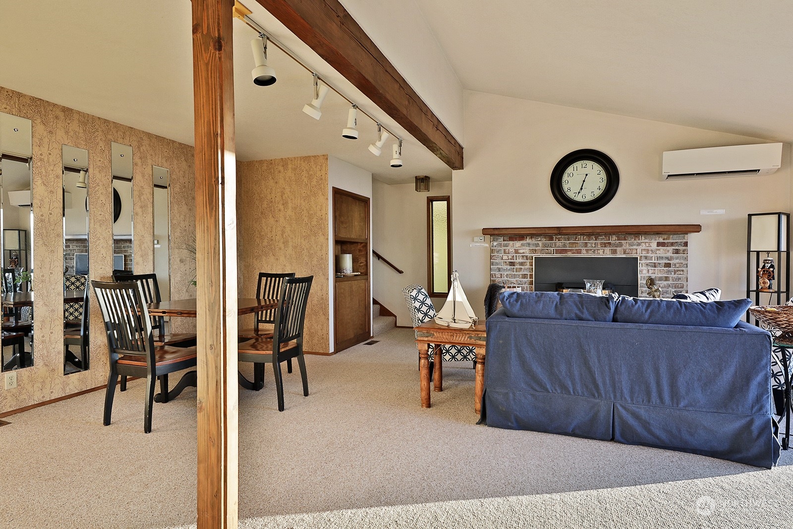 6288 Barr Beach Road Freeland, WA 98249 - Photo 18 of 40 a living room with furniture and a fireplace