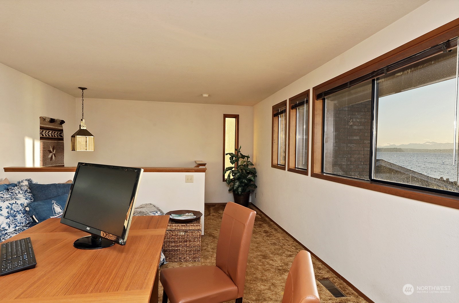 6288 Barr Beach Road Freeland, WA 98249 - Photo 22 of 40 a view of a workspace with furniture and a window