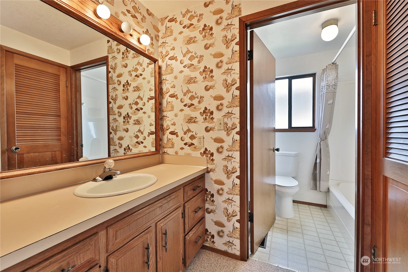 6288 Barr Beach Road Freeland, WA 98249 - Photo 26 of 40 a bathroom with a sink toilet and shower