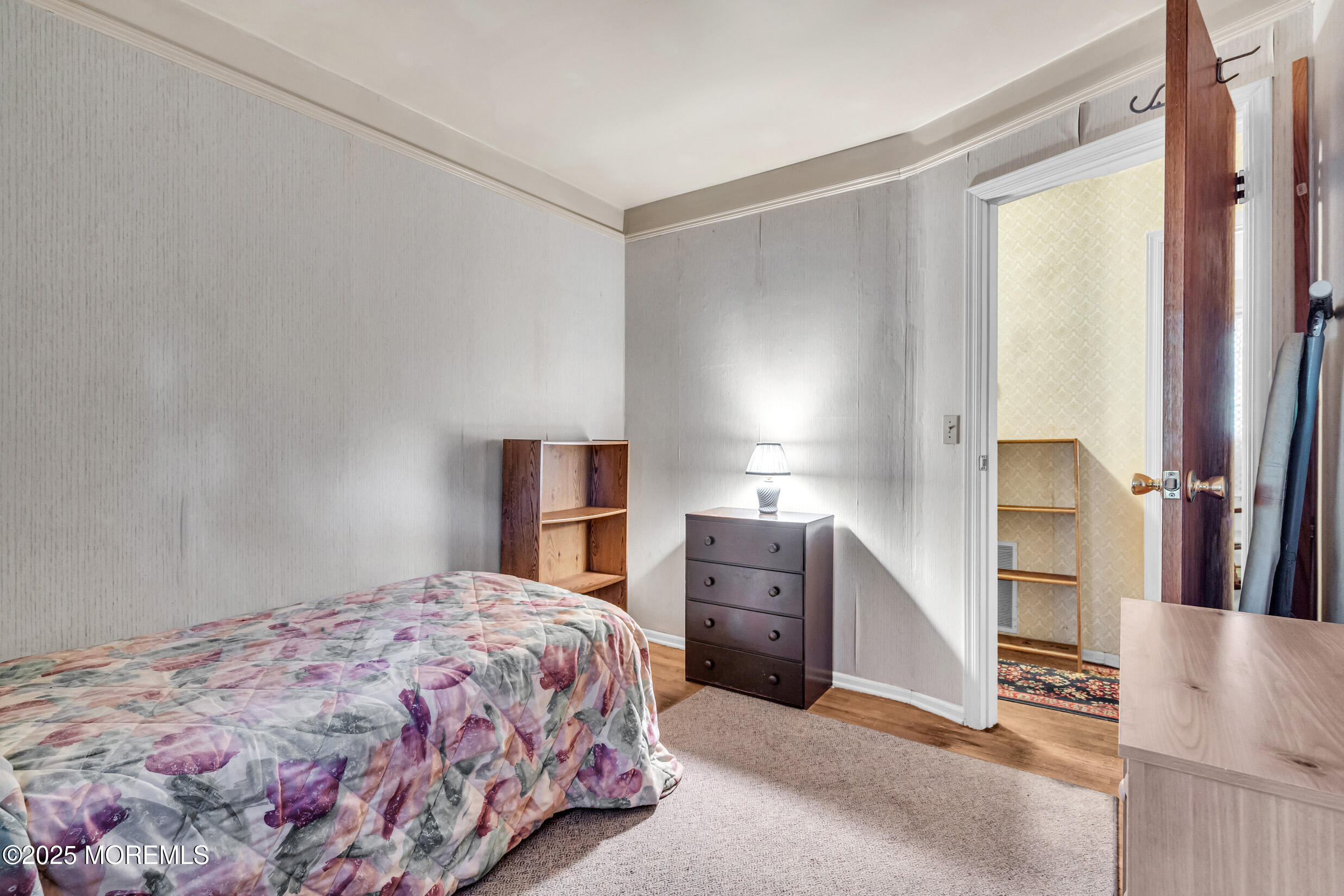 30 Russell Street Toms River, NJ 08753 - Photo 13 of 27 a bedroom with a bed and a refrigerator