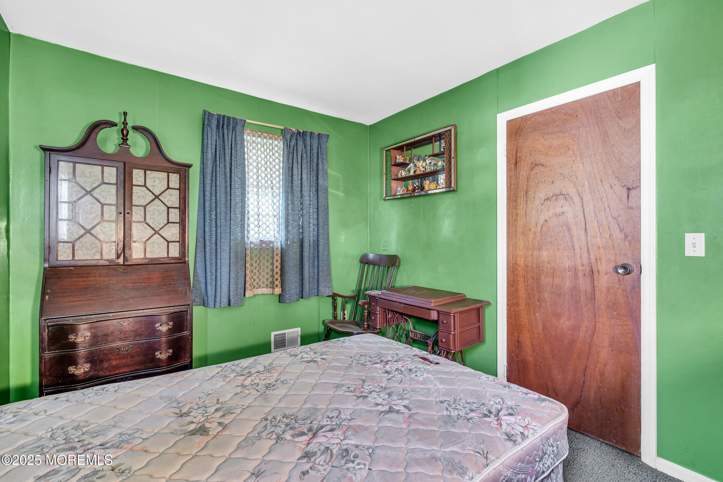 30 Russell Street Toms River, NJ 08753 - Photo 15 of 27 a bedroom with a bed and a table