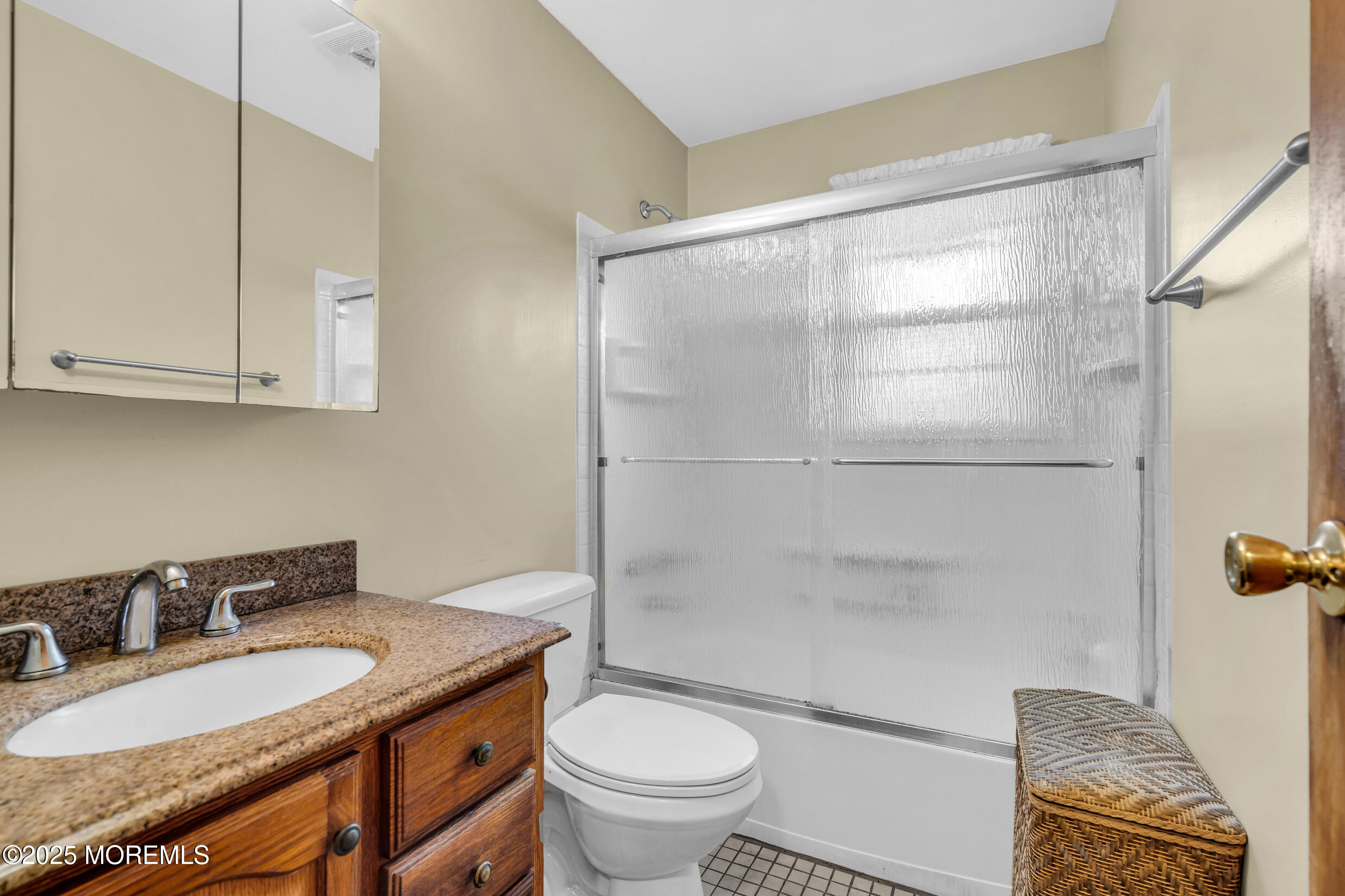 30 Russell Street Toms River, NJ 08753 - Photo 9 of 27 a bathroom with a granite countertop sink a toilet and a mirror