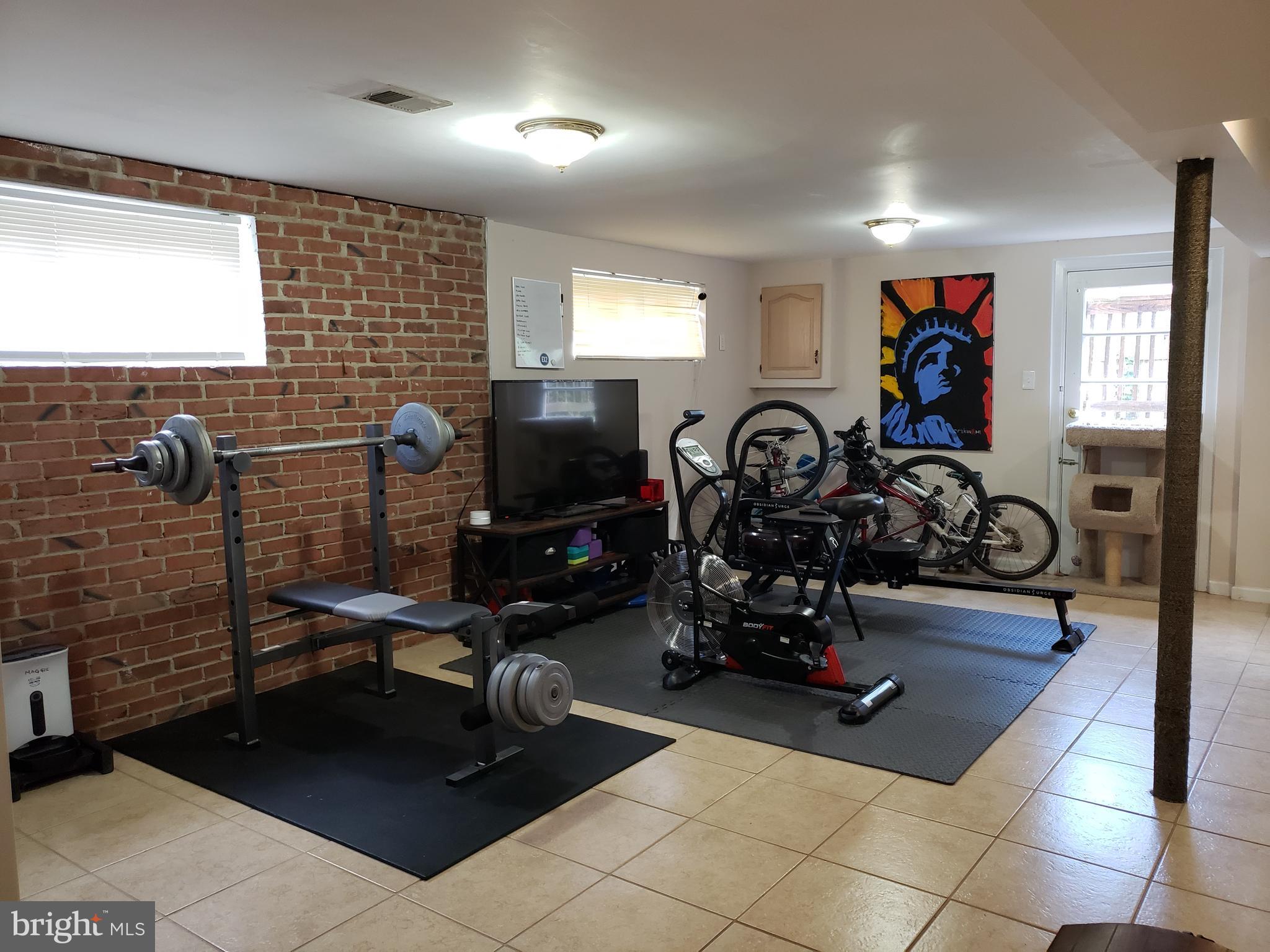 8639 Victoria Road Springfield, VA 22151 - Photo 13 of 17 a view of a room with gym equipment