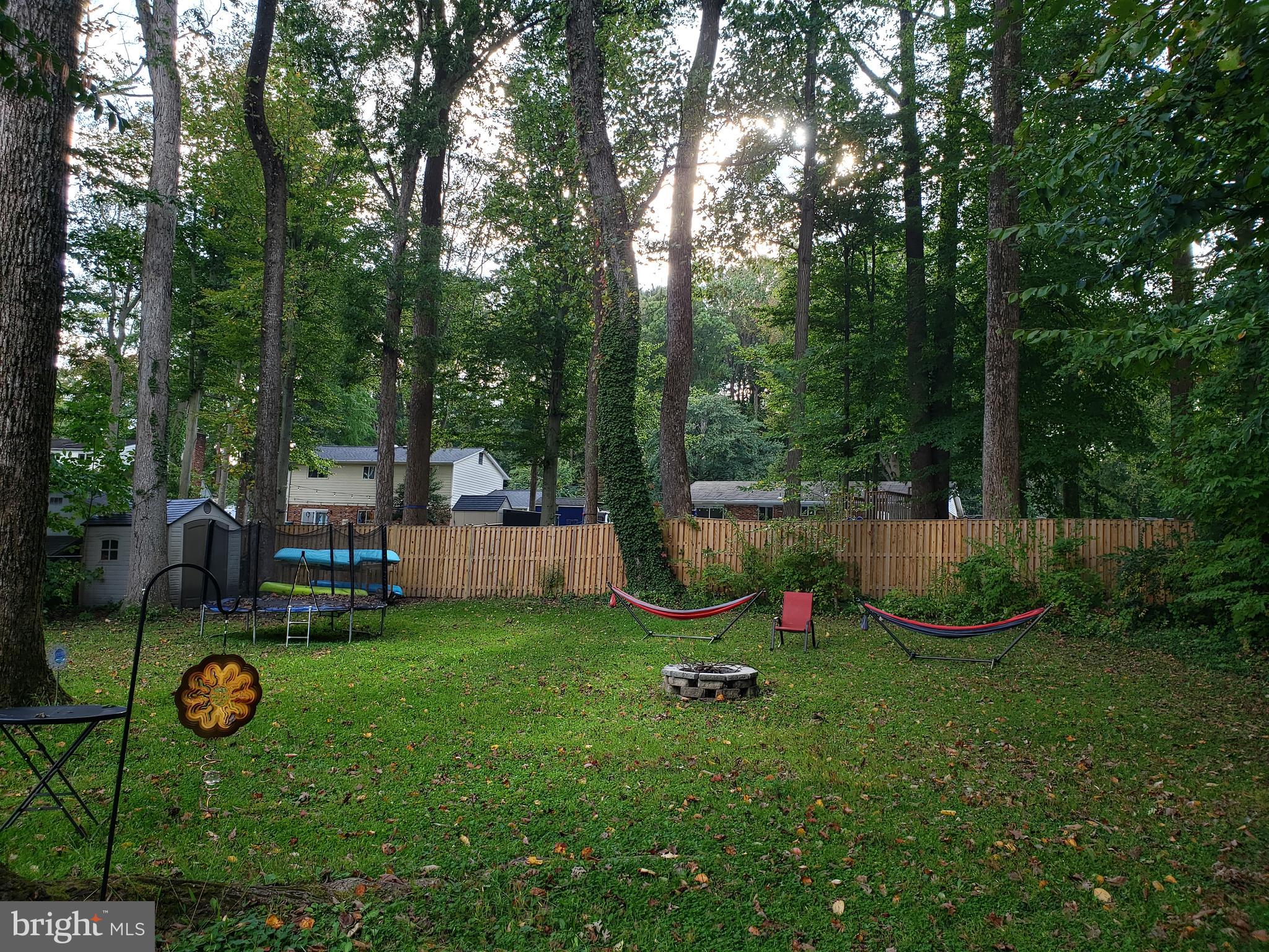 8639 Victoria Road Springfield, VA 22151 - Photo 17 of 17 a view of a table and chairs in the garden