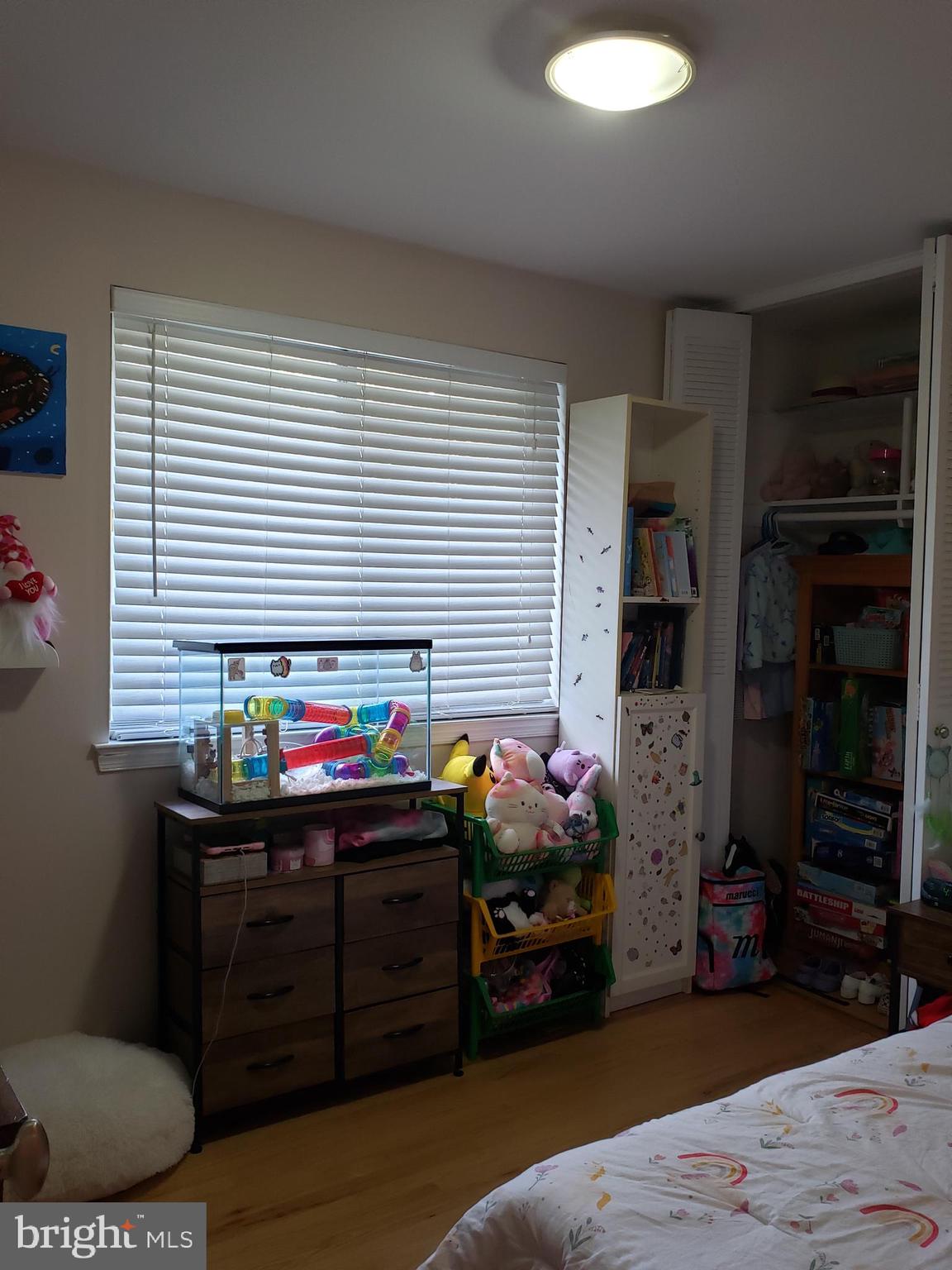8639 Victoria Road Springfield, VA 22151 - Photo 10 of 17 a room that has a bed and a chair in it
