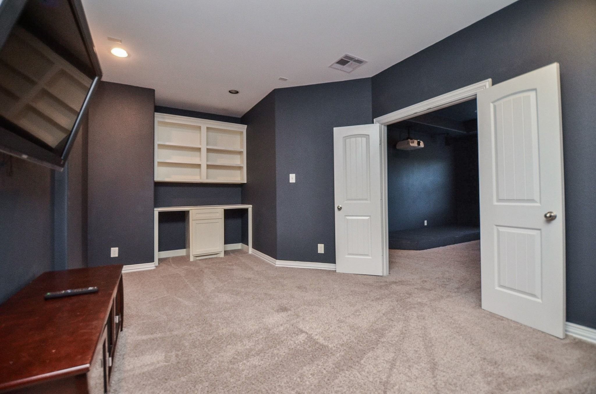 2714 Topaz Cove Lane Rosharon, TX 77583 - Photo 37 of 50 a view of an empty room with a fireplace