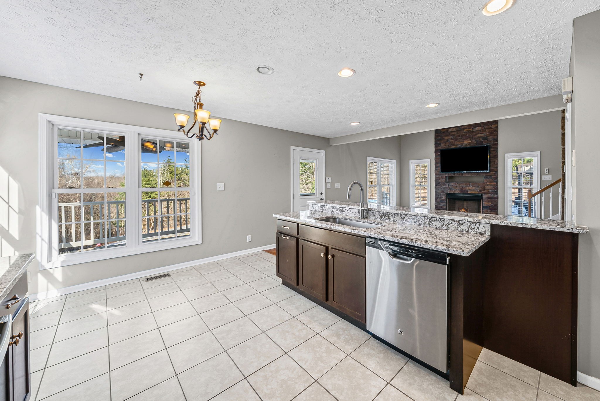 2875 Jarrell Ridge Road Clarksville, TN 37043 - Photo 20 of 73 a kitchen with stainless steel appliances granite countertop a sink and a stove top oven