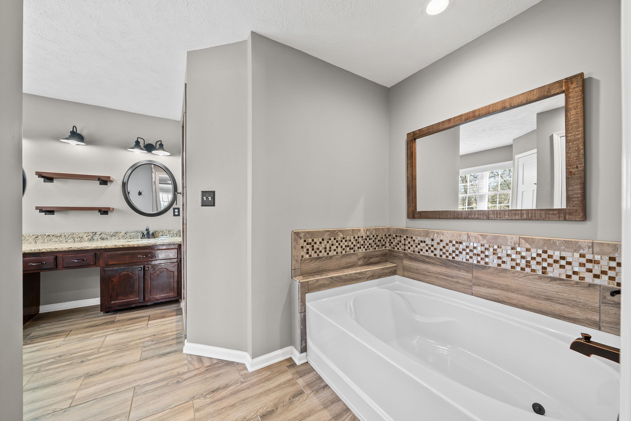 2875 Jarrell Ridge Road Clarksville, TN 37043 - Photo 29 of 73 a bathroom with a granite countertop tub sink and mirror