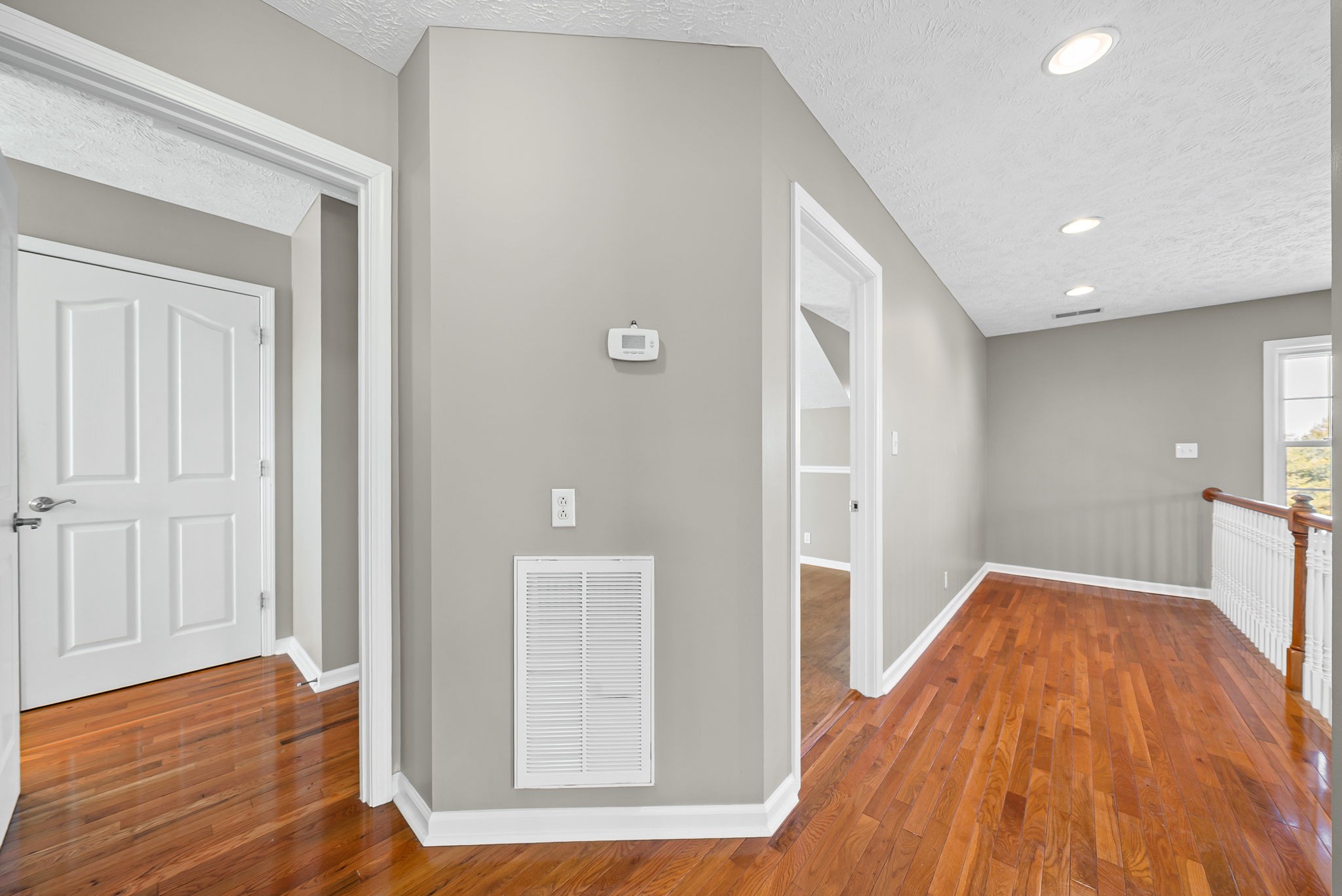 2875 Jarrell Ridge Road Clarksville, TN 37043 - Photo 33 of 73 a view of a hallway with wooden floor and staircase