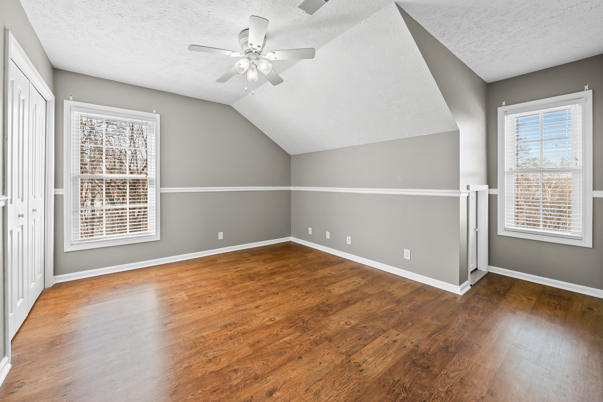 2875 Jarrell Ridge Road Clarksville, TN 37043 - Photo 34 of 73 an empty room with wooden floor and windows