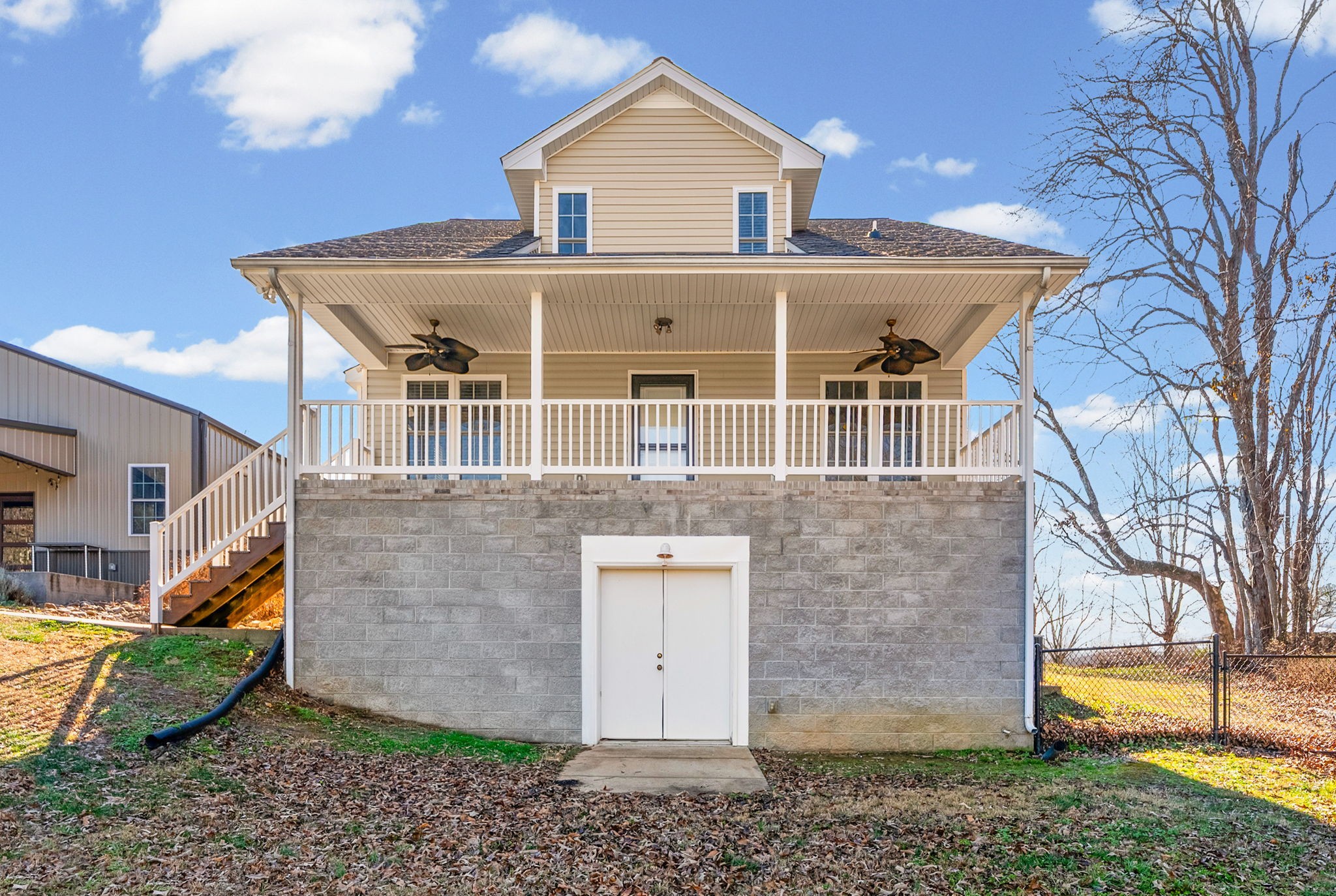 2875 Jarrell Ridge Road Clarksville, TN 37043 - Photo 48 of 73 a view of a big house with a yard and large tree