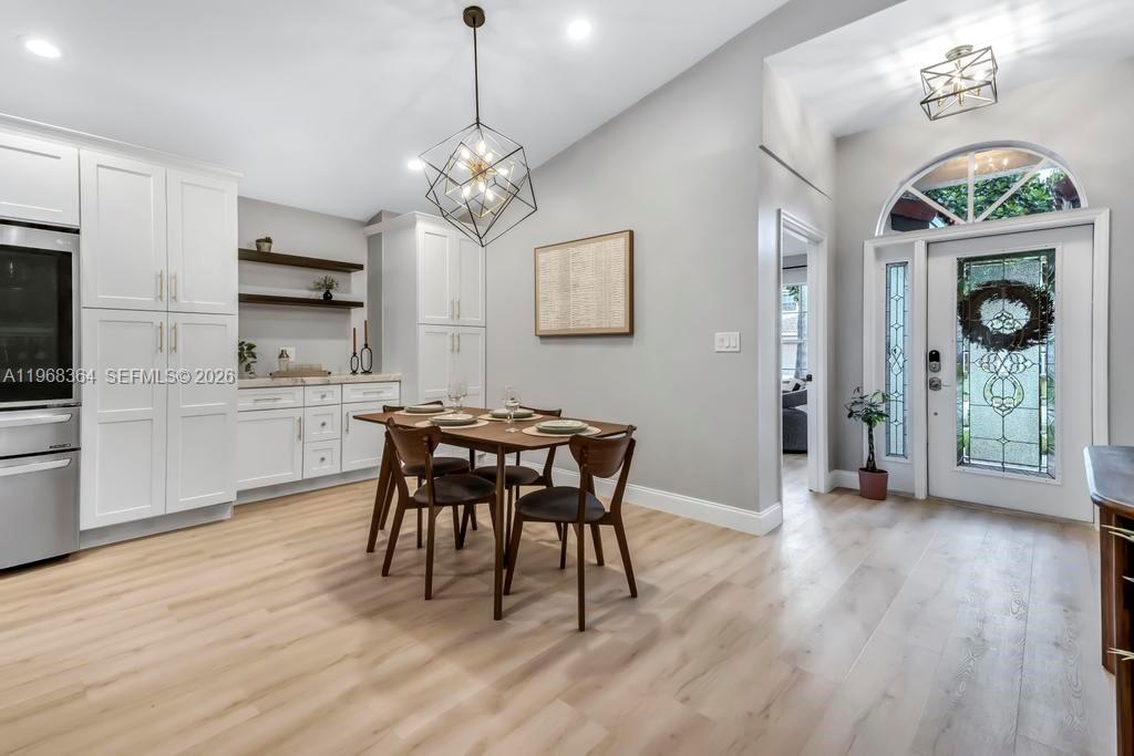 2972 Southwest 174th Avenue Miramar, FL 33029 - Photo 12 of 55 a view of a dining room with furniture window and wooden floor