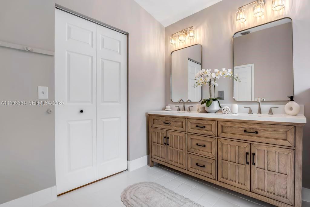 2972 Southwest 174th Avenue Miramar, FL 33029 - Photo 20 of 55 a bathroom with a double vanity sink and a mirror